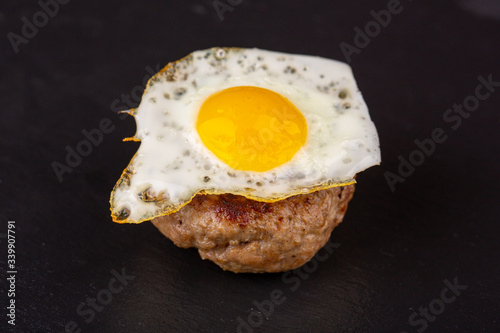 Cutlet grilled, served with eggs
