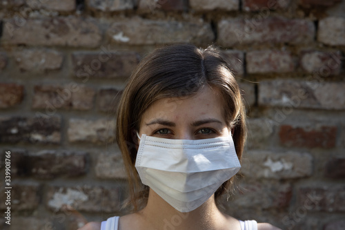Woman protecting herself wearing a face mask