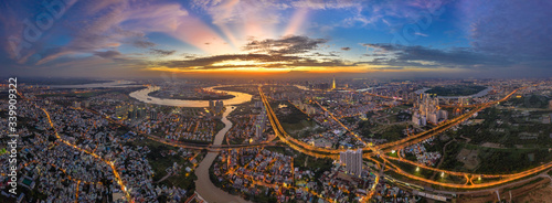 Top view aerial of Mai Chi Tho road, Thu Thiem peninsula and center Ho Chi Minh City, Vietnam  with development buildings, transportation, energy power infrastructure. View from District 2
