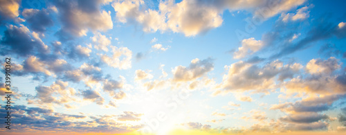 Sky clouds background. Beautiful landscape with clouds and orange sun on sky