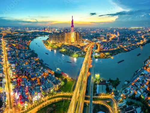 Top view aerial of center Ho Chi Minh City and Saigon bridge with development buildings, transportation, energy power infrastructure. Financial and business centers in  Vietnam. View from District 2 © Hien Phung
