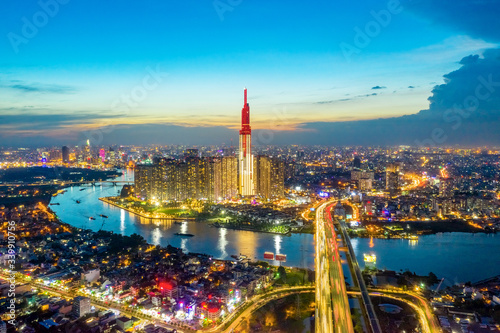 Top view aerial of center Ho Chi Minh City and Saigon bridge with development buildings  transportation  energy power infrastructure. Financial and business centers in  Vietnam. View from District 2