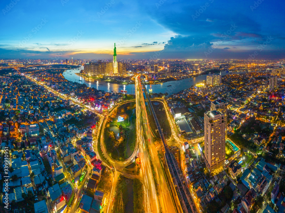 Top view aerial of center Ho Chi Minh City and Saigon bridge with development buildings, transportation, energy power infrastructure. Financial and business centers in  Vietnam. View from District 2
