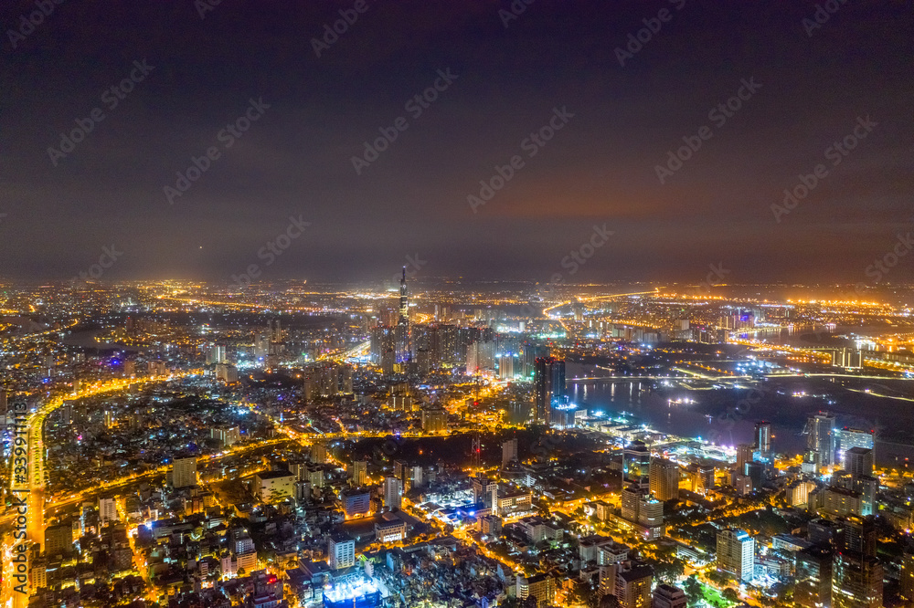 Top view aerial of Thu Thiem peninsula and center Ho Chi Minh City with development buildings, transportation, energy power infrastructure. Financial and business centers in developed Vietnam Top view aerial of Thu Thiem peninsula and center Ho Chi Minh City with development buildings, transportation, energy power infrastructure. Financial and business centers in developed Vietnam