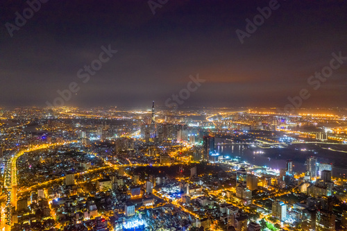 Top view aerial of Thu Thiem peninsula and center Ho Chi Minh City  with development buildings  transportation  energy power infrastructure. Financial and business centers in developed Vietnam