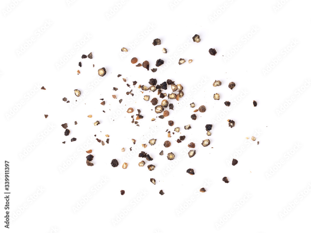 Ground black pepper on a white background top view Ground black pepper on a white background top view
