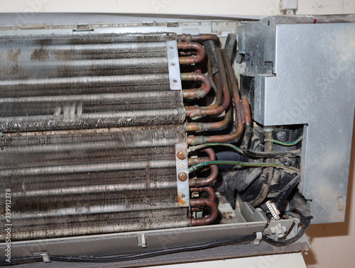 Dirty fan coil of air conditioner indoor unit. Maintaining the air conditioner concept.