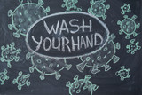 Wash your hand. Outbreak Warning. written white chalk on blackboard in connection with epidemic of coronavirus worldwide.