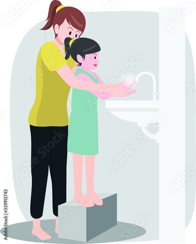 Mother helping her daughter washing her hands