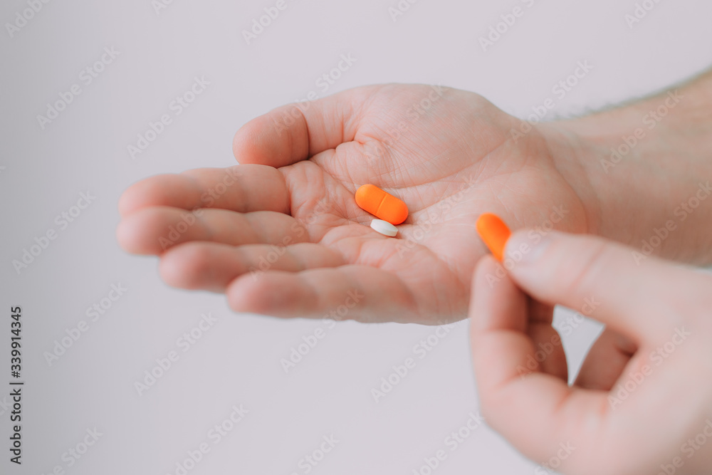 hand with pills hand with pills