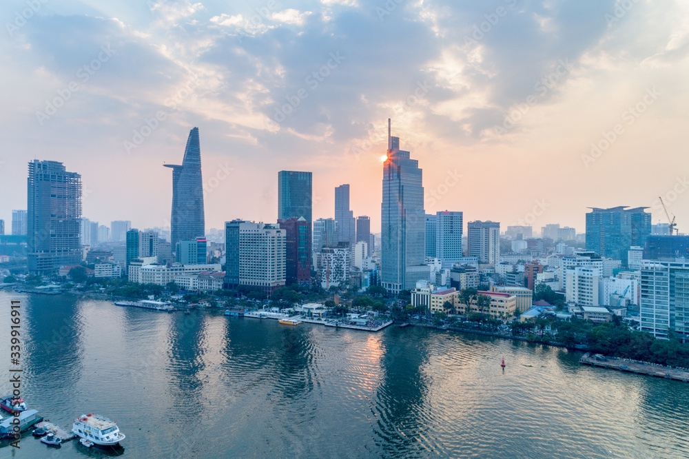 Top view aerial photo from flying drone of a Ho Chi Minh City with development buildings, transportation, energy power infrastructure. Financial and business centers in developed Vietnam.