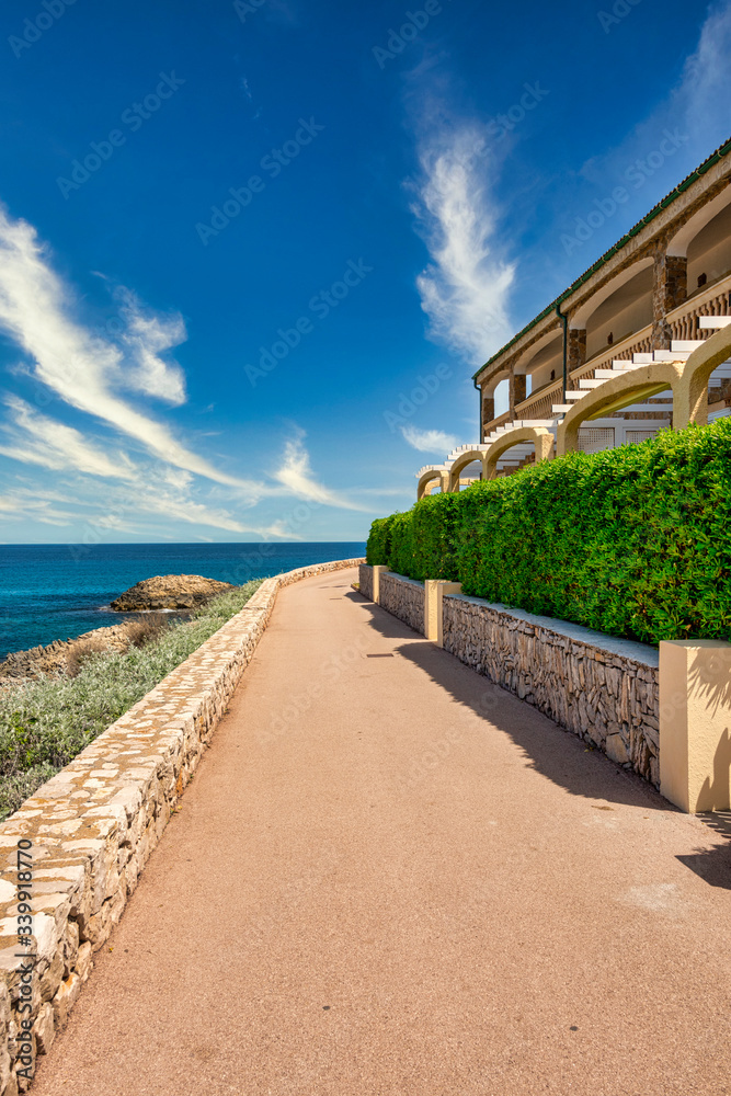 Way alongside holiday apartments on the spanish balearic island Mallorca near cala ratjada with view to the Mediterranean Sea