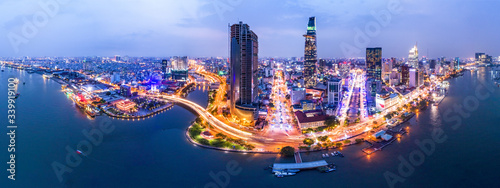 Top view aerial photo from flying drone of a Ho Chi Minh City with development buildings, transportation, energy power infrastructure. Financial and business centers in developed Vietnam.