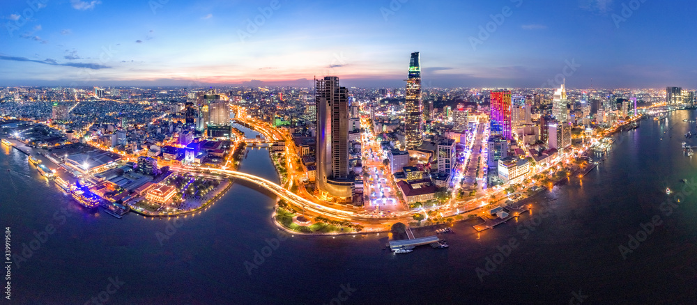 Top view aerial photo from flying drone of a Ho Chi Minh City with development buildings, transportation, energy power infrastructure. Financial and business centers in developed Vietnam.