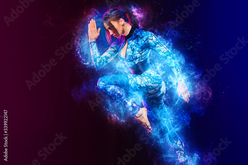 Fototapeta Naklejka Na Ścianę i Meble -  Sprinter and runner girl. Running concept. Fitness and sport motivation. Strong and fit athletic, woman sprinter or runner, running on black background in the fire wearing sportswear.