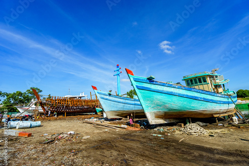 Worker in Shipyard. Shipyard industry    ship building  Big ship on floating dry dock in shipyard  Phu Quoc island  Kien Giang  Vietnam