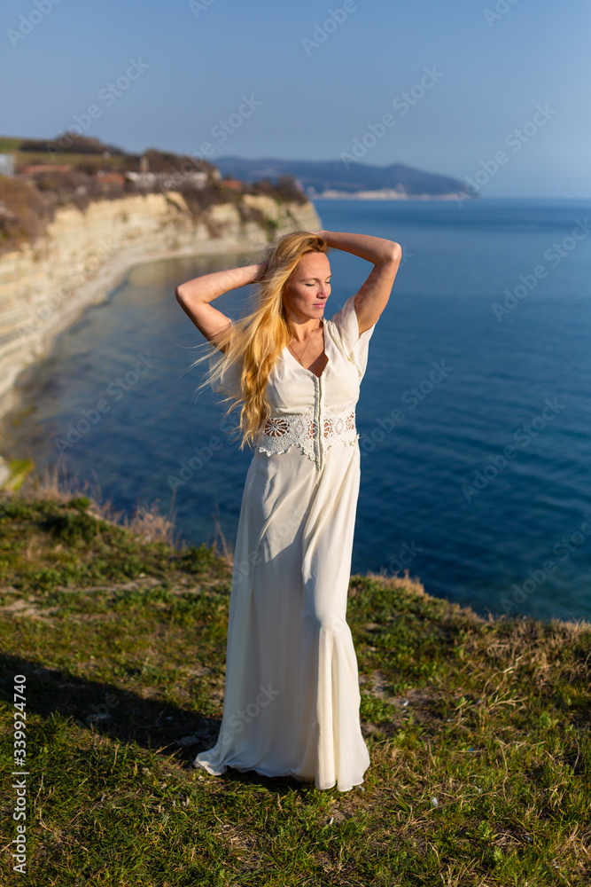 Blonde model at the sea at summer Blonde model at the sea at summer