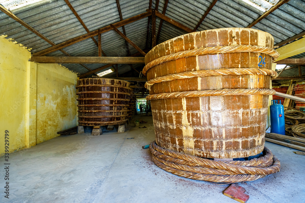 factory fish sauce production facilities on Phu Quoc island, Kien Giang, Vietnam by traditional fermented method of anchovies fermented brewed in large