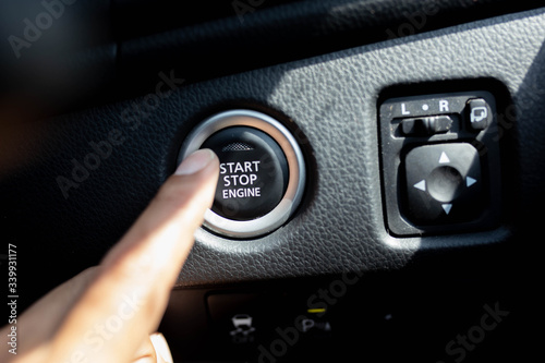 Start stop engine button on a modern car dashboard.