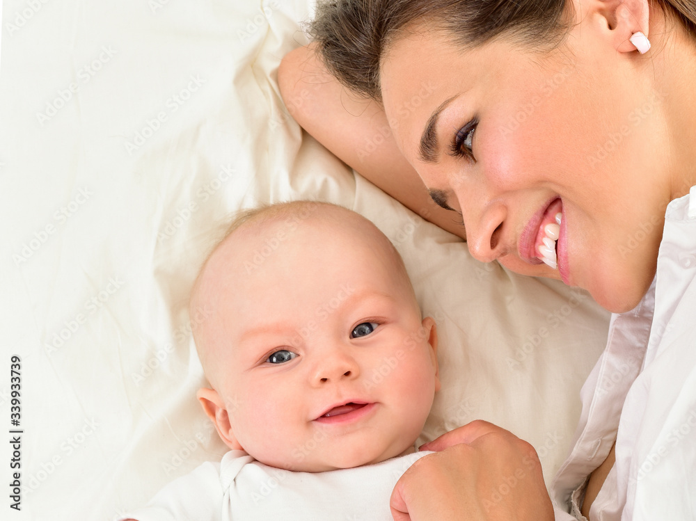 Mother and baby playing and smiling. Happy family. Mother and baby playing and smiling. Happy family.