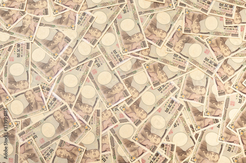 10 000 Yen Banknotes - Background with several banknotes of ten thousand yen banknotes  front . Japanese money. Concept  Financial abundance. Horizontal shot.