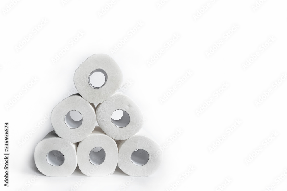 Fototapeta premium Toilet paper rolls on white backgorund. Hygiene concept. White paper texture. Household concept.