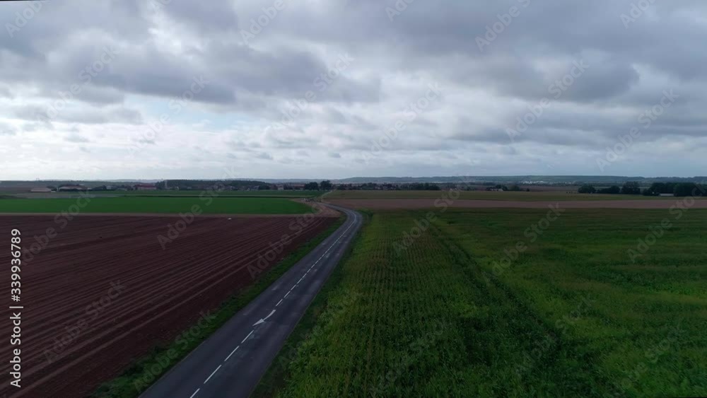 drone of a field in europe with clouds drone of a field in europe with clouds
