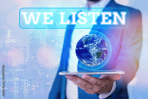 Text sign showing We Listen. Business photo showcasing Group of showing that is willing to hear anything you want to say Elements of this image furnished by NASA photo