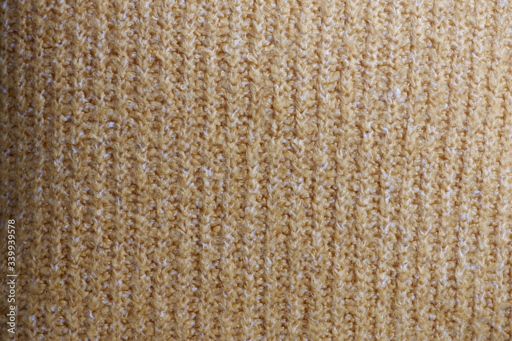 The texture of the yellow wool fabric. Advertising background. Texture The texture of the yellow wool fabric. Advertising background. Texture