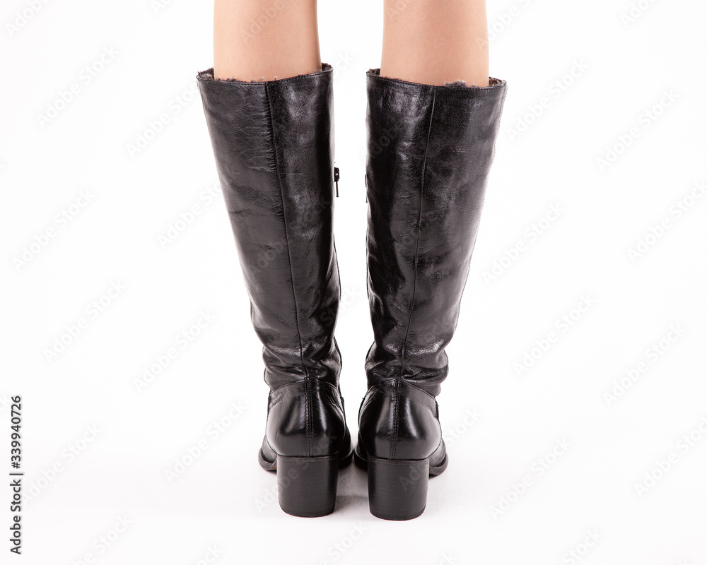Stylish fashionable women's shoes on legs on a white background in studio Stylish fashionable women's shoes on legs on a white background in studio
