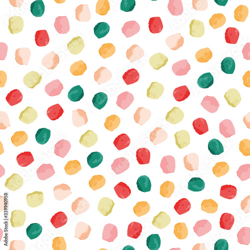 Textural dots vector seamless pattern. Girly seamless pattern. Pink, green, yellow, red circles on white background. Vector illustration. Surface pattern design.