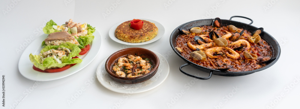 Spanish food together in one shot, paella, Tortilla espanola, Gambas Pil Pil, Ensalada de Pescado Spanish food together in one shot, paella, Tortilla espanola, Gambas Pil Pil, Ensalada de Pescado