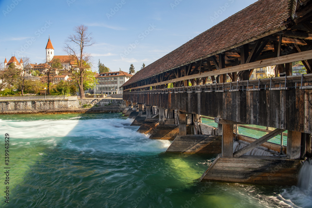 Castle Thun Switzerland with old wooden bridge over the river - Travel concept