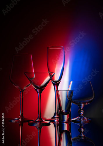 
Five glass goblets on color gradient background
