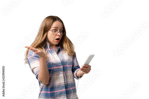 Young caucasian woman using smartphone, devices, gadgets isolated on white studio background. Concept of modern technologies, gadgets, tech, emotions, ad. Copyspace. Talking, meeting online education.