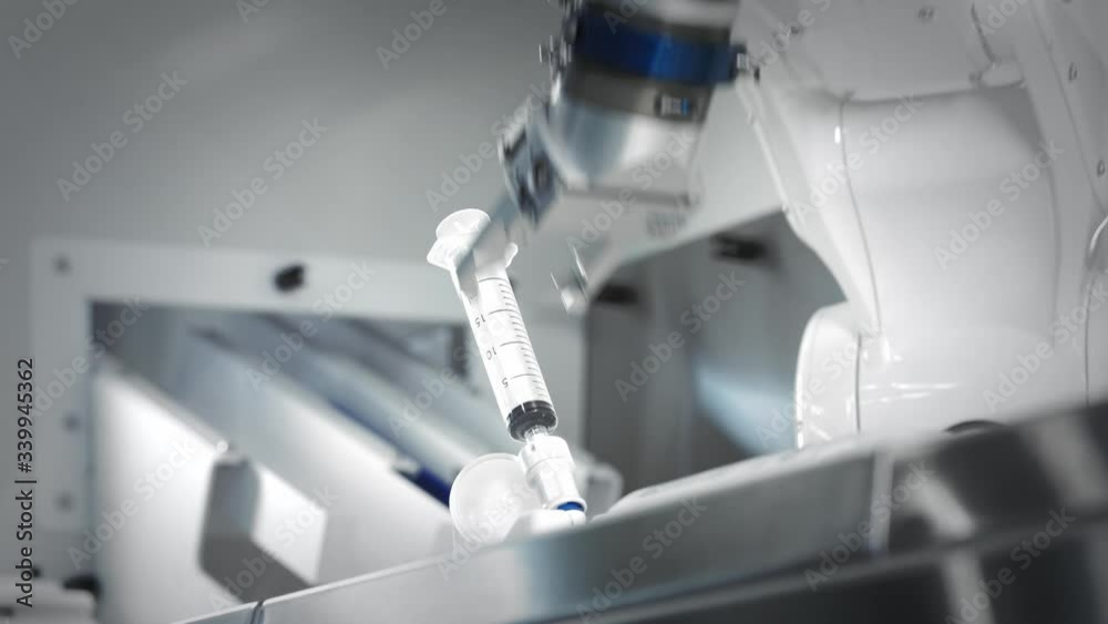 Robot Injecting The innovative arms of a robotic arm make an injection of chemotherapy ...