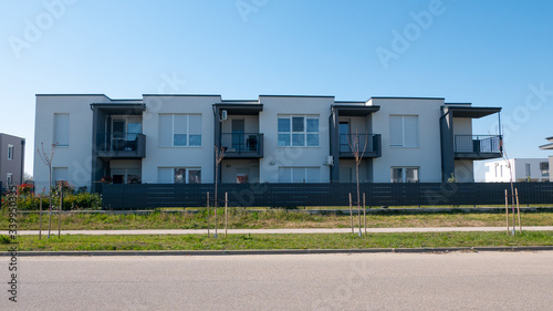 Facade of a modern apartment condominium in a sunny day. New, Luxury Apartment Building.