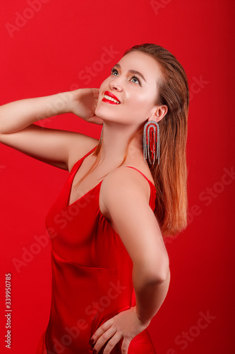 Redhead girl in a red dress