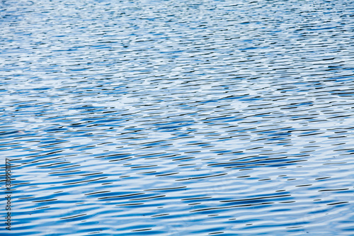 Ripple pattern on a blue water surface