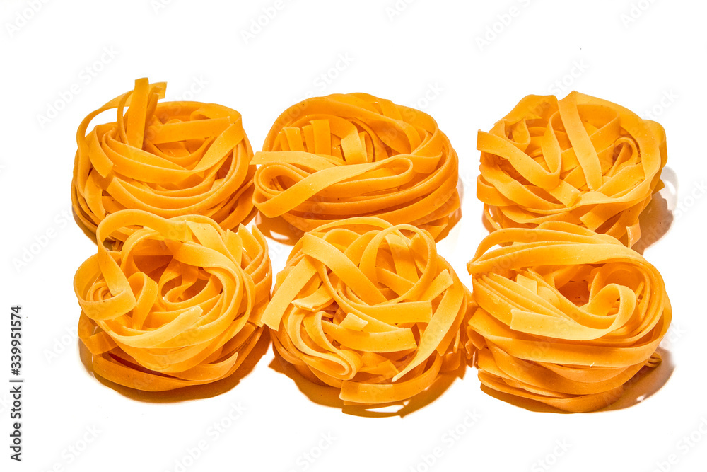 Italian pasta nests on a white background Italian pasta nests on a white background