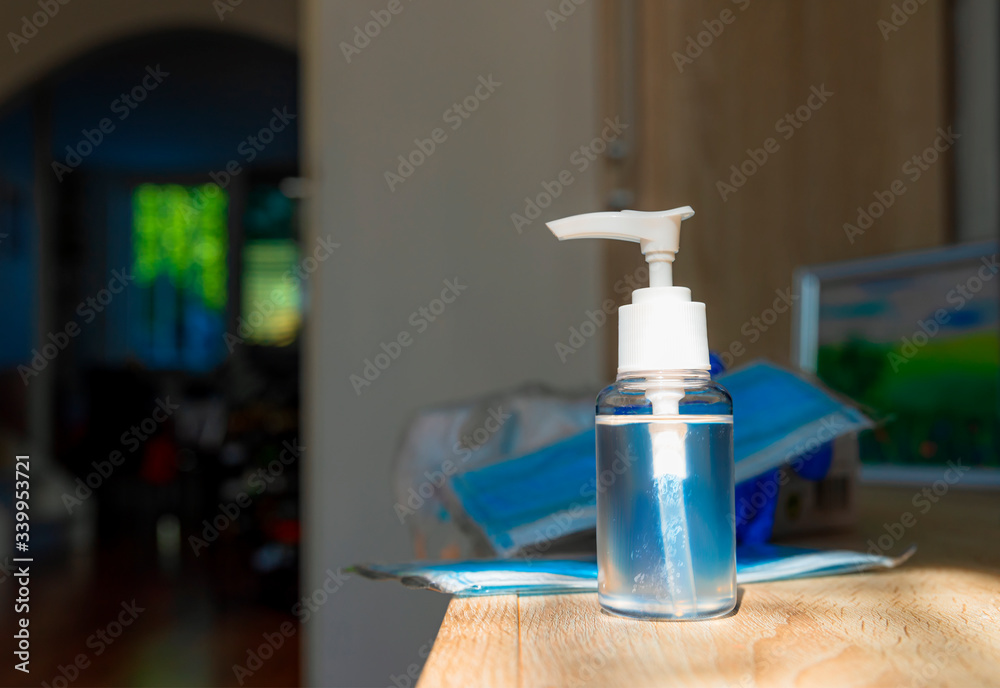 Coronavirus prevention medical surgical masks and hand sanitizer gel for hand hygiene corona virus protection.. Selective focus. Coronavirus prevention medical surgical masks and hand sanitizer gel for hand hygiene corona virus protection.. Selective focus.