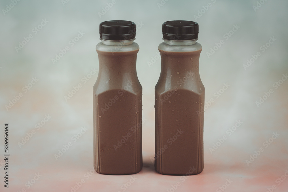 Tasty dark cocoa milk in plastic bottle