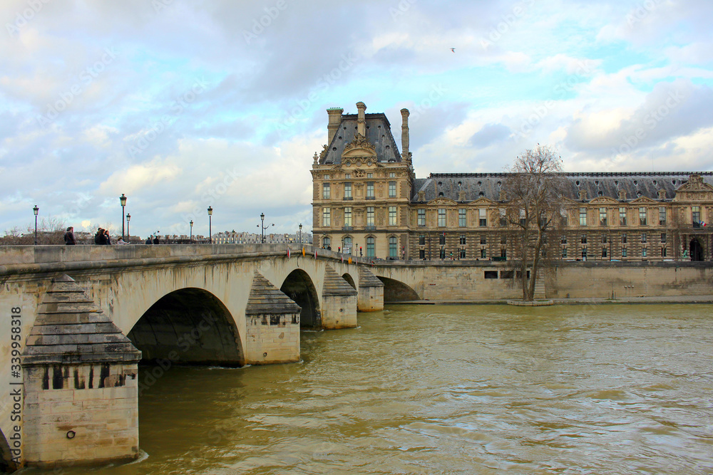View of the Seine River and the old medieval bridge in the central part of the city.