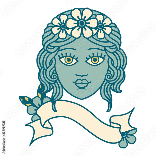 tattoo with banner of female face with crown of flowers