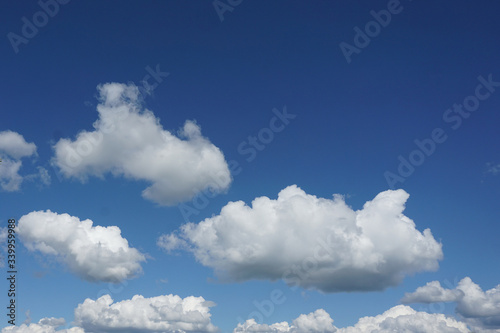 Canvas Print gradient of sky with snow-white lush clouds