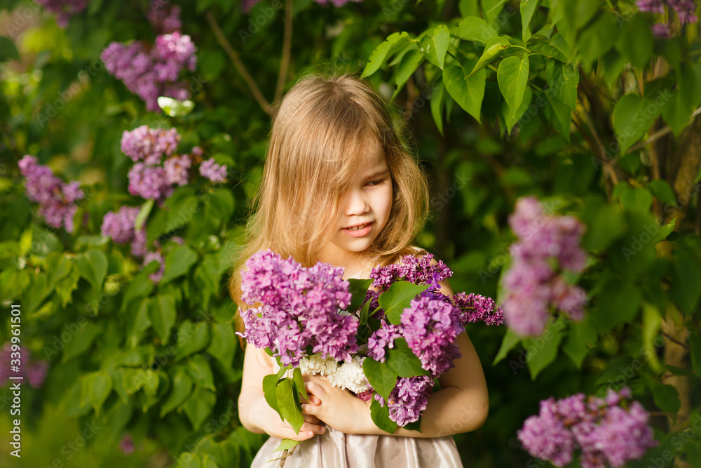 portrait girl in pink dress near lilac flowers portrait girl in pink dress near lilac flowers