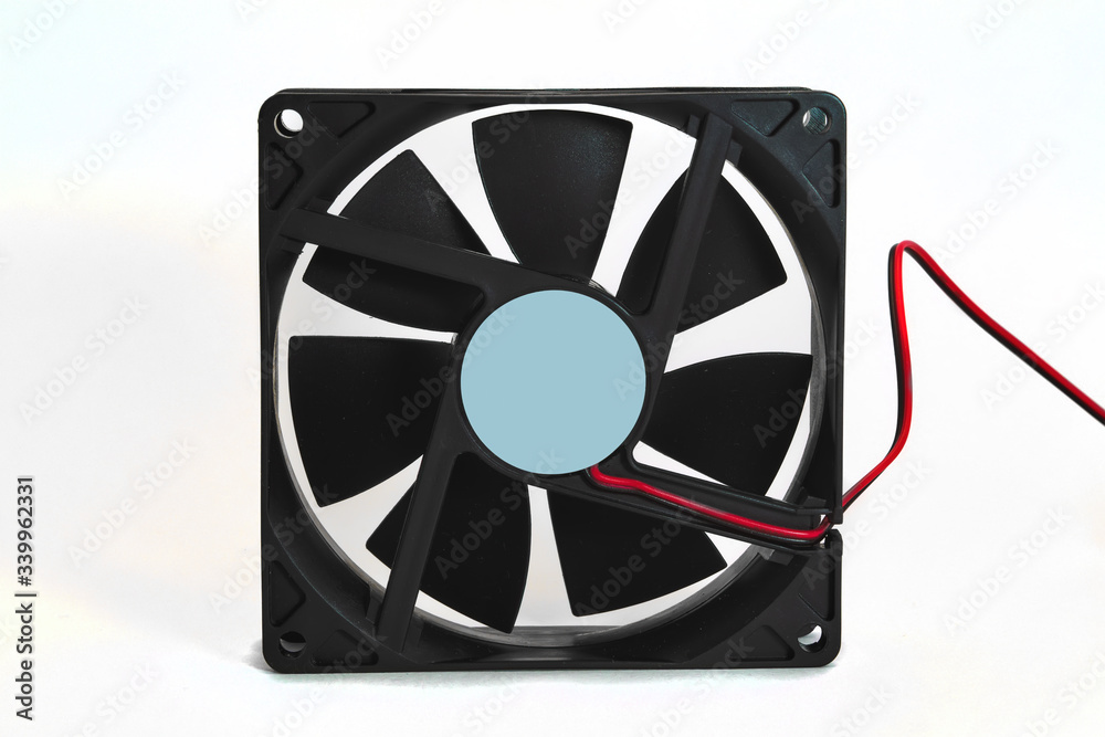 A fan for a desktop computer case isolate on a white background close-up. A fan for a desktop computer case isolate on a white background close-up.