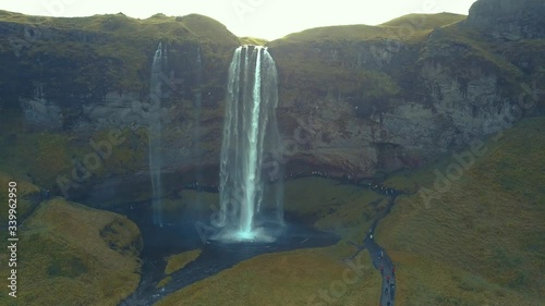 4K aerial footage of amazing waterfalls in South Iceland known as Seljalandsfoss Waterfall during summer season.