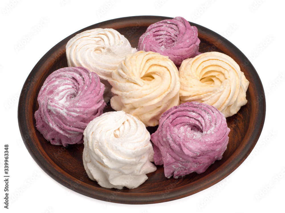 Marshmallow zephyr in a plate on a white background Marshmallow zephyr in a plate on a white background