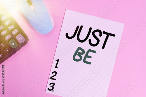 Handwriting text writing Just Be. Conceptual photo to do the things you believe in and want to be accepted for Electronic calculator device wire mouse striped sheet colored background photo